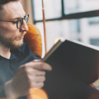man reading book